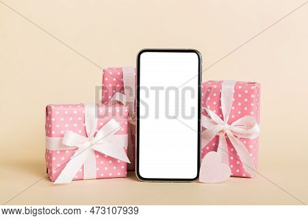 Mobile Phone With Blank Screen On Colored Background With Hearts, Calendar And Gift Box, Valentine D