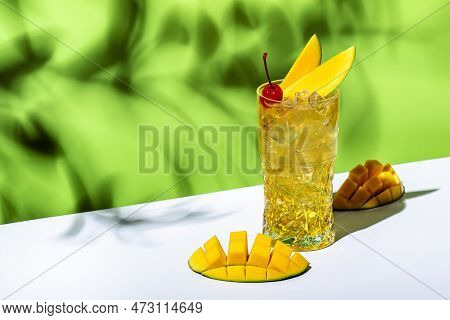 Mango Rum Collins Alcoholic Cocktail Drink With White Rum, Syrup, Ginger Beer, Lemon Juice, Ice And 