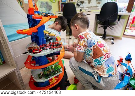 Kyiv, Ukraine - March, 2023: Kids Play With Collection Of Colorful Toy Cars. Hot Wheels Ultimate Gar