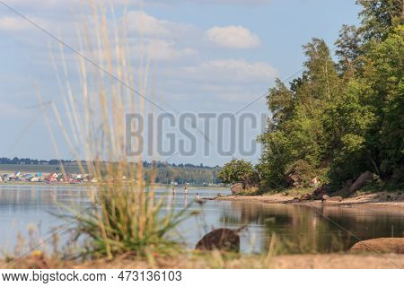 A Quiet Backwater, People Rest In The Shade, Swim In The Lake. Around Rocks And Trees