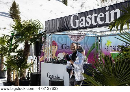 Austria, Sportgastein - March 18, 2023: Event Palmen Auf Den Almen, The Singer Looks At The Camera