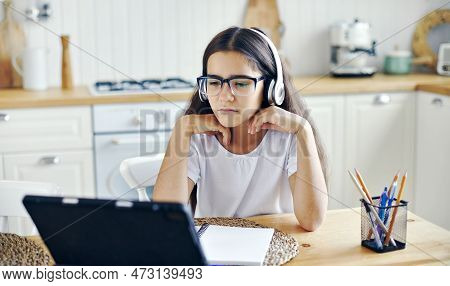 Pretty Girl 12s Wear Headphones And Glasses Make Task, Studying Online, Experiences Vision Problems,