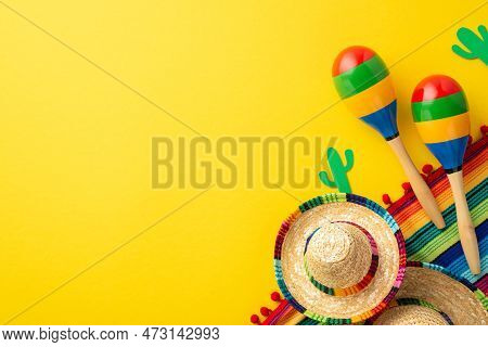 Cinco-de-mayo Concept. Top View Photo Of Sombrero Hats Colorful Striped Serape Cactus Silhouettes An