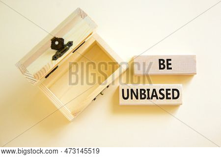 Be Unbiased Symbol. Concept Words Be Unbiased On Wooden Block. Beautiful White Table White Backgroun