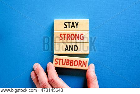 Stay Strong And Stubborn Symbol. Concept Words Stay Strong And Stubborn On Wooden Block. Beautiful B