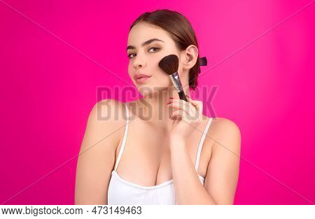 Woman Applies Powder On The Face Using Makeup Brush. Girl Doing Contouring Apply Blush On Cheeks. Fa