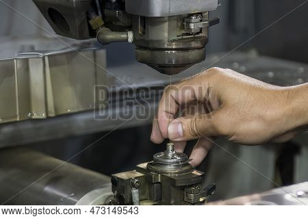 Closeup Scene The Operator Setup The Wire Edm Machine. The Die Insert Cutting Process By Wire Cut Ma