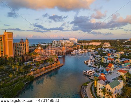 Harborside Villas aerial view at sunset with Atlantis Hotel at the background at Nassau Harbour, from Paradise Island, Bahamas.