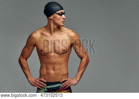 Portrait Of A Swimmer In A Cap And Mask, Half-length Portrait, Young Athlete Swimmer Wearing A Cap A