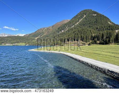 Sports And Recreational Trail Along The Alpine Lake Davos Or Loop Around Mountain Lake Davosersee, D
