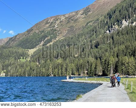 Sports And Recreational Trail Along The Alpine Lake Davos Or Loop Around Mountain Lake Davosersee, D