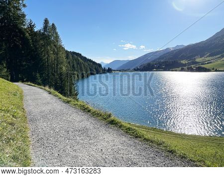 Sports And Recreational Trail Along The Alpine Lake Davos Or Loop Around Mountain Lake Davosersee, D