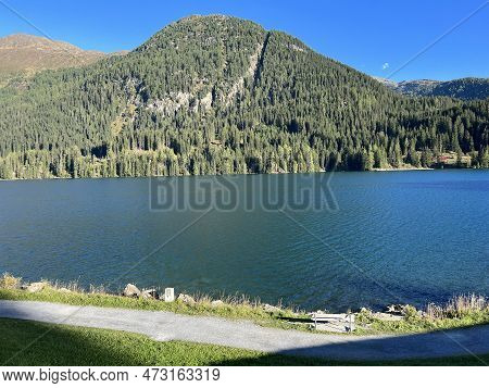 Sports And Recreational Trail Along The Alpine Lake Davos Or Loop Around Mountain Lake Davosersee, D