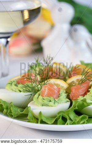 Eggs Stuffed With Avocado, Salmon And Lemon. Easter Eggs. The Perfect Appetizer For Your Holiday Tab