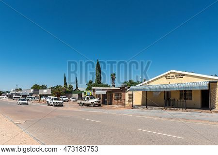 Groblershoop, South Africa - Feb 24, 2023: A Street Scene, With Businesses And Vehicles, In Groblers