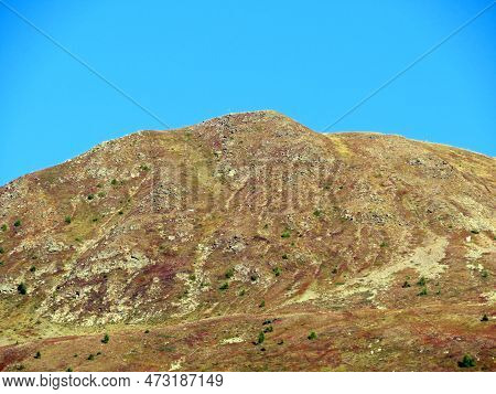 High Swiss Alpine Peak Hüreli (huereli Or Hureli, 2444 M) Above The Tourist And Sports Mountain Lake