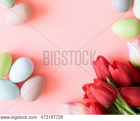 Easter Eggs And Tulips On Light Green Background