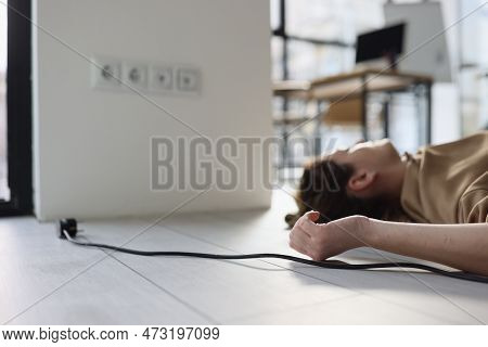 Woman Lies On Floor In Office Near Plug Struck With Electric Shock. Female Employee Suffered Due To 