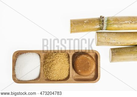 White Sugar, Brown Sugar And Sugar Cane Panela On White Background