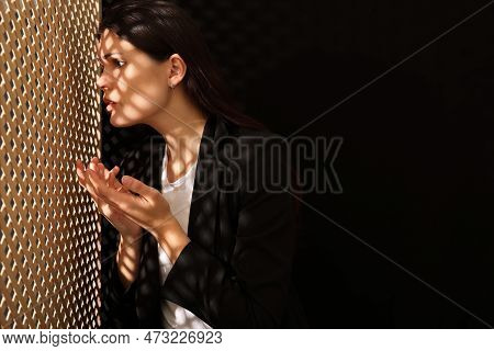 Woman Talking To Priest During Confession Near Wooden Partition In Booth, Space For Text