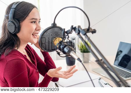 Asian Woman Is Speaking To Encourage On A Radio Broadcasting Station. Beautiful Female Organized The