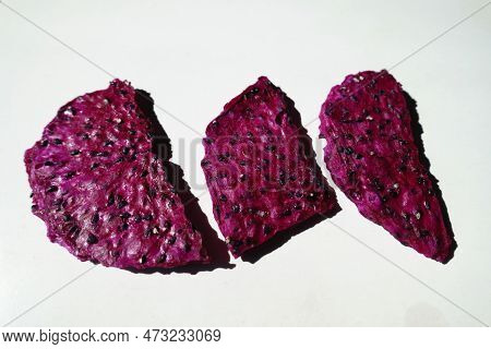 Three Purple Crispy Dried Dragon Fruit Chips From Above