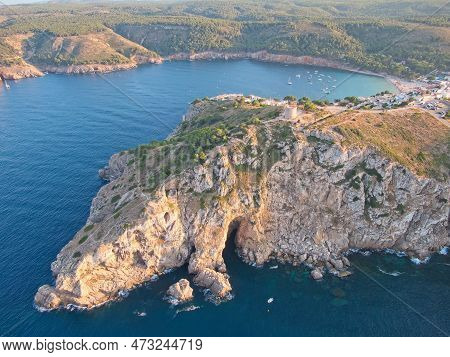 Aetial View Of Torre De Montgó Tower And And Caves Near Montgó Cliff In Town L'escala, Catalonia, Sp