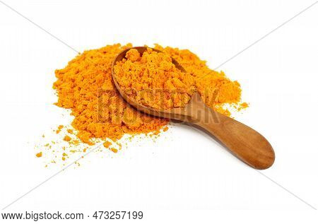 Close Up One Wooden Scoop Spoon Full Of Yellow Turmeric Spice Powder Spilled And Spread Around Isola