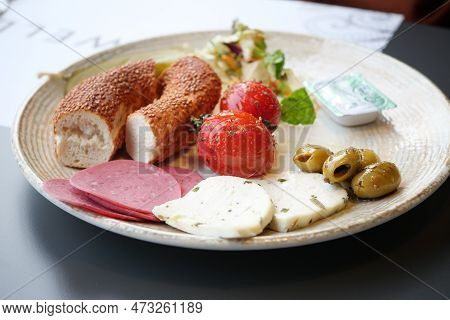 Salami Sausage , Olive And Bread On A Plate