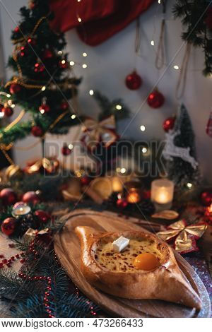 Traditional Georgian Adjarian Khachapuri With Suluguni Cheese, Egg Yolk, Butter