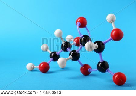 Molecule Of Vitamin C On Light Blue Background. Chemical Model