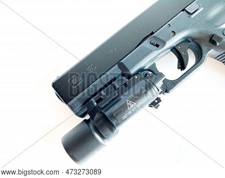 Bangkok Thailand - 21 March 2023: Air Soft Gun Glock 18C Pistol Gun With Flashlight Sight On The Whi