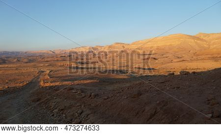 Negev Desert Landscape At Sunrise On The Bottom Of The Crater Makhtesh Gadol, In The South Of Israel