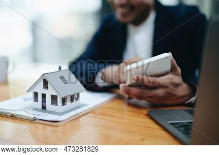 Guarantee, Mortgage, Contract, Contract, Signed, Real Estate Agent Or Bank Officer Holding A Calcula