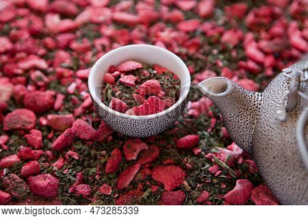Dehydrated Strawberry-dried Tea With Mint And Strawberries Near Tea Pot. Dry Herbal Tea With Pepperm