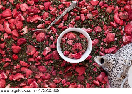 Dehydrated Strawberry-dried Tea With Mint And Strawberries Near Tea Pot. Dry Herbal Tea With Pepperm