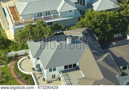 Aerial View Of Big Expensive American Building Roof With Blue Solar Photovoltaic Panels For Producin