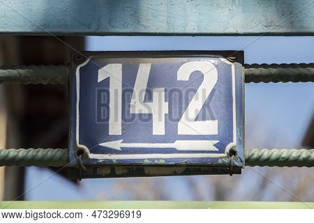 Weathered Grunge Square Metal Enameled Plate Of Number Of Street Address With Number 142