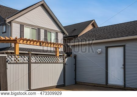 Modern Detached Storey House With Gate Grey Fence In Suburb Street Home. Wooden Gate And Fence On Th