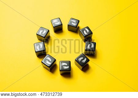 Moving In Circles Without End. Circle Made Of Blocks With Footprints. Endless Movement Without Any C