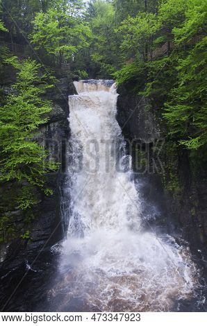 A Large Waterfaill Within Bushkill Falls In Lehman Township Pennsylvania On An Overcast Summer Day.