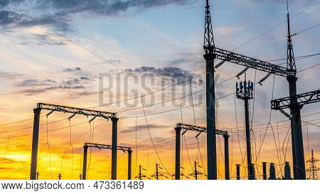 Production Of Fuel And Electricity.electrical Networks With Wires And Transformers At Sunset.power T