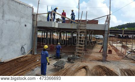 Ilheus, Bahia, Brazil - October 7, 2022: Workers During Construction Of A Polyclinic Of The Estada D