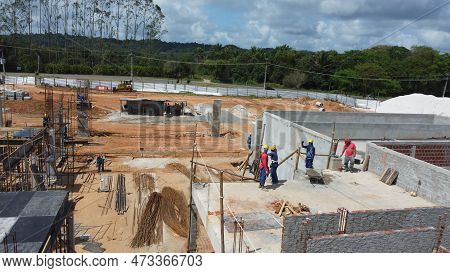 Ilheus, Bahia, Brazil - October 7, 2022: Workers During Construction Of A Polyclinic Of The Estada D