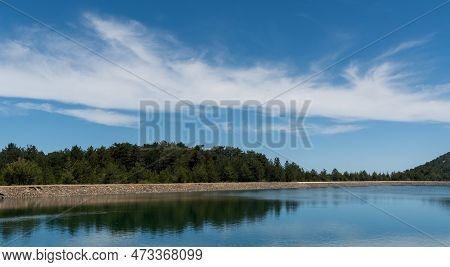 Panoramic View Of Dam Full Of Water In The Forest . Prodromos Water Reservoir Troodos Mountains Cypr