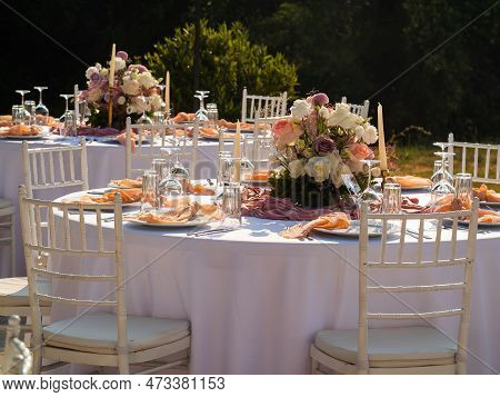 Wedding Banquet Concept. Chairs And Round Table For Guests, Served With Cutler And, Flowers And Croc