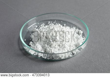 Petri Dish With Calcium Carbonate Powder On Grey Table