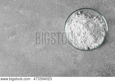 Petri Dish With Calcium Carbonate Powder On Light Grey Table, Top View. Space For Text
