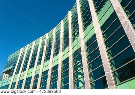 Composition Of Blue Sky And Curved Glass And Steel