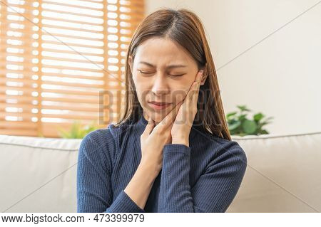 Closing Eyes Asian Young Woman Touching Cheek, Face Expression From Toothache, Tooth Decay Or Sensit